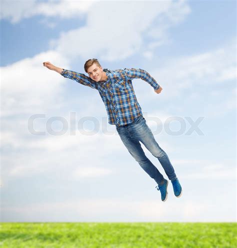Smiling Young Man Jumping In Air Stock Image Colourbox