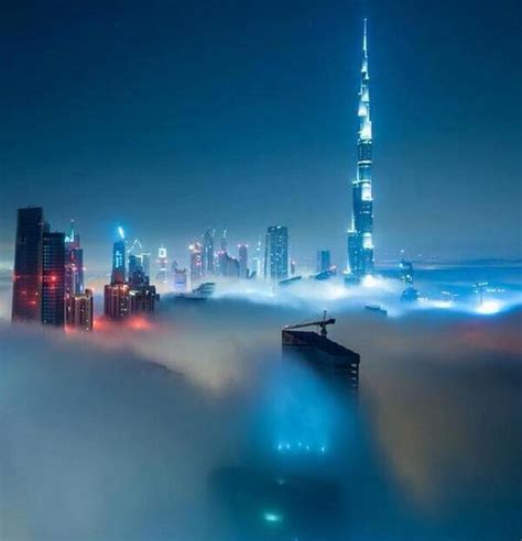 Skyline Of Dubai At Night Under A Blanket Of Fog Cityscape