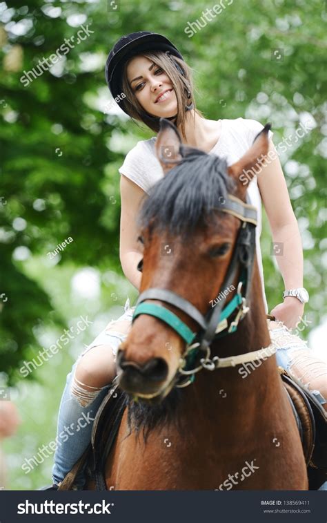 Beautiful Girl Riding A Horse In Countryside Stock Photo