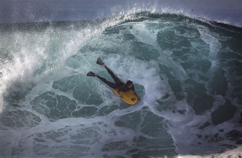 Surfers Race To Catch Massive Waves Across Southland La Times