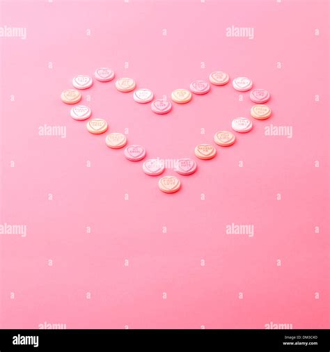 Love Heart Sweets In A Heart Shape On A Pink Background Stock Photo Alamy