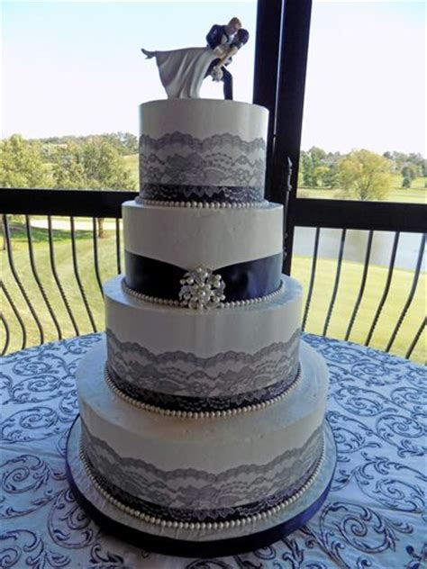 4 Tier Buttercream Wedding Cake Decorated With Navy Blue Ribbons Grey
