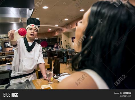 japanese chef squirting sake drink image and photo bigstock