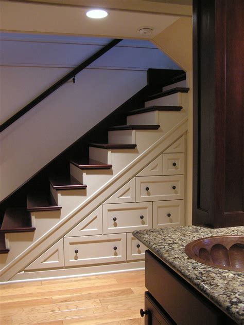 Custom Cabinets Maximize Unused Space Under The Stair Well Finish Is