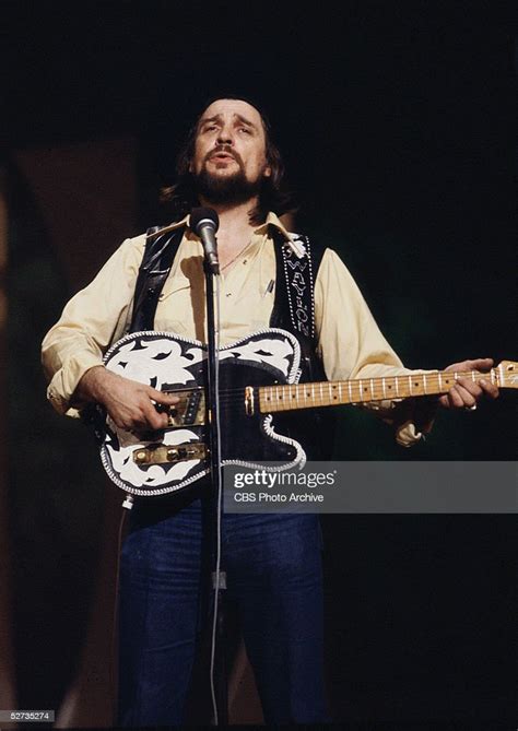 American country music singer Waylon Jennings performs on stage ...