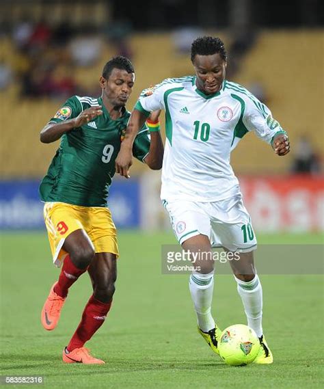 Getaneh Kebede Of Ethiopia And John Obi Mikel Of Nigeria During The