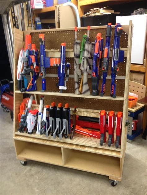 This diy nerf gun wall was seriously so easy (special thanks to my super handy husband for helping all my visions work) and i wish we would've absolutely love the nerf gun storage!! pegboard nerf wall - Google Search | kids | Nerf storage, Nerf gun storage, Nerf darts