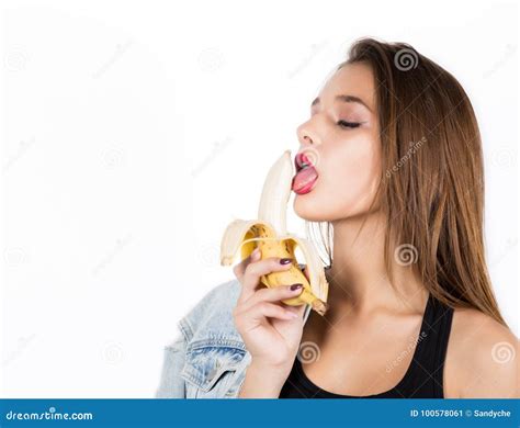 Young Sensual Woman Eating Banana On White Background Provocation
