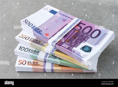 euro currency money cash money euro bills stacks of euro notes on concrete background in five