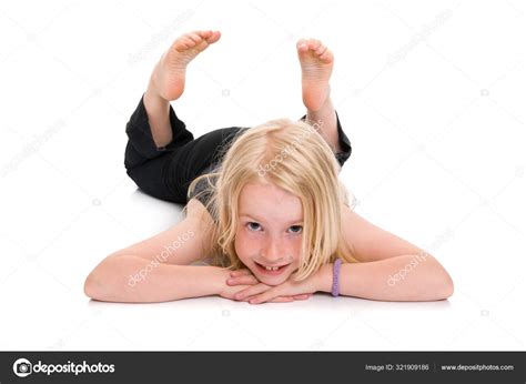 Young Blonde Girl Lying On Floor And Smiling Isolated On White Stock