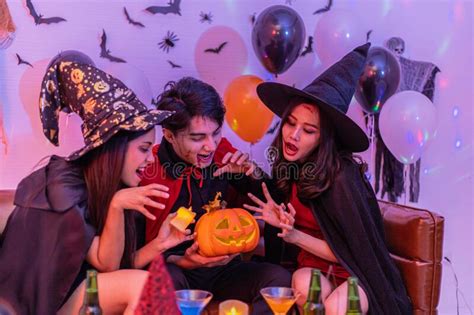 Asian Young People In Costumes Celebrating Halloween Group Of Friends