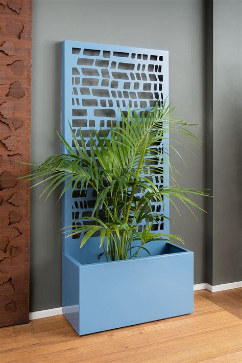 A Freestanding Screen Offering Privacy And A Generous Planter For Your