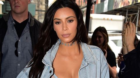 Kim Kardashian Pairs Bizarre Plastic Thigh High Boots With Bra Top And Yeezy Jean Jacket
