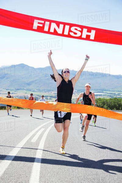 Runner Crossing Race Finish Line Stock Photo Dissolve