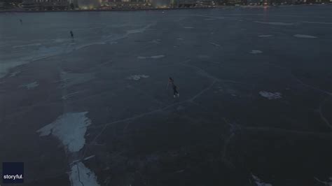 Ice Skaters Glide On Frozen Wisconsin Lake