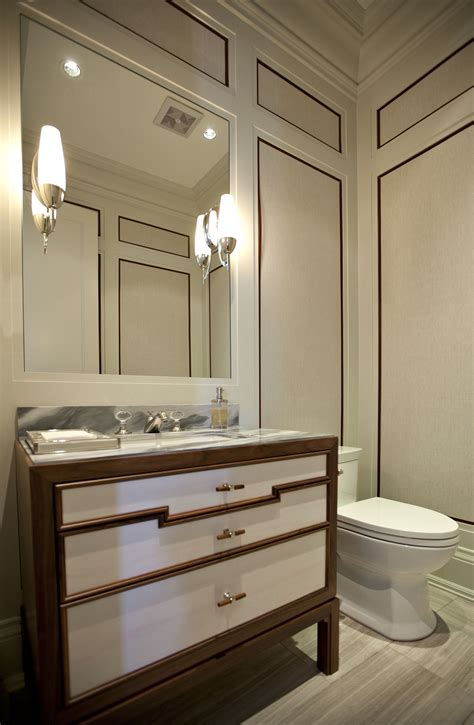Unique Powder Room Vanity Surrounded With Panelled Walls With Leather