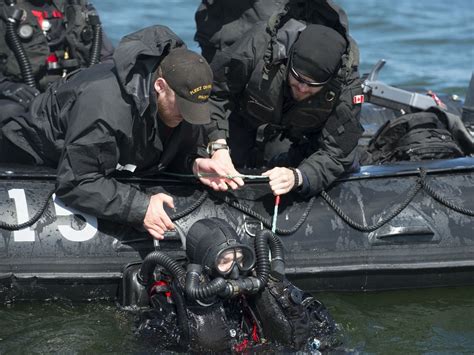 Royal Canadian Navy Divers Check Shipwreck For Unexploded Shells And