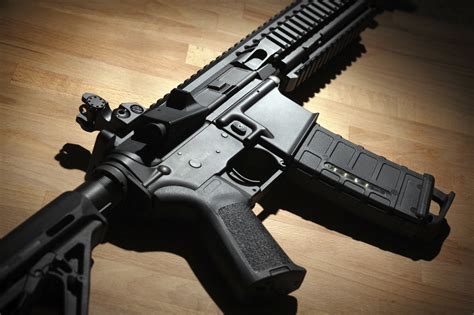 Modern Custom Ar 15 M4a1 Carbine On A Wooden Surface Liberty News Now
