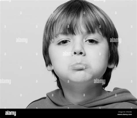 Portrait Of A Young Boy Sulking Stock Photo Alamy