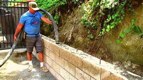Whether you're building a retaining wall or just need some extra privacy, a cinder block wall is an affordable way to get the job done. How to do a split face block retaining wall California ...