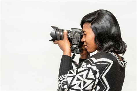 Black Female Photographer Taking Photo On Camera · Free Stock Photo
