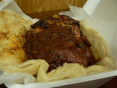 jerk chicken in a roti i tasted the plantain and it was fa… flickr