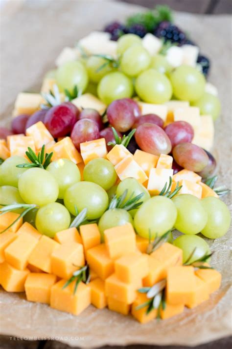 Quick and easy appetizers made from rolling cream cheese, bell peppers, olives, basil, and parmesan, and cutting th. How to make a Fruit & Cheese Platter for Christmas | Appetizers for kids, Fruit appetizers ...