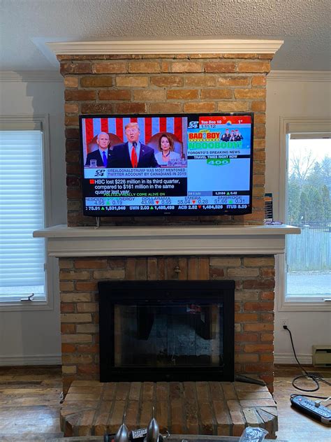 As the name implies, this is a sunken compartment another trendy way to have a tv above your fireplace is by recessing it back into an alcove. Above Fireplace TV Installation - LeslievilleGeek TV ...