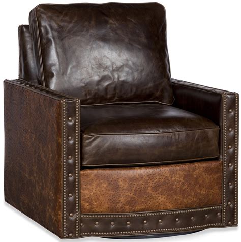 Polished nickel nail on chair glides. Upholstered Nail Head Club Chair