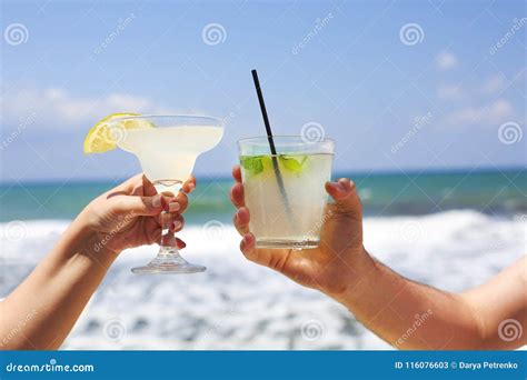 Two Cocktail Glasses In Man And Woman Hands Stock Image Image Of Margarita Lemon 116076603