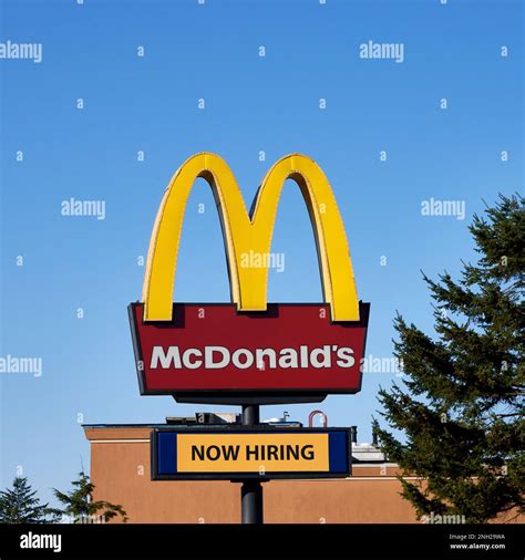 McDonald's sign with the Golden Arches and red background and a sign