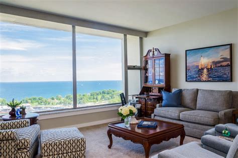 Traditional Living Room With Large Windows And Waterfront Views Hgtv