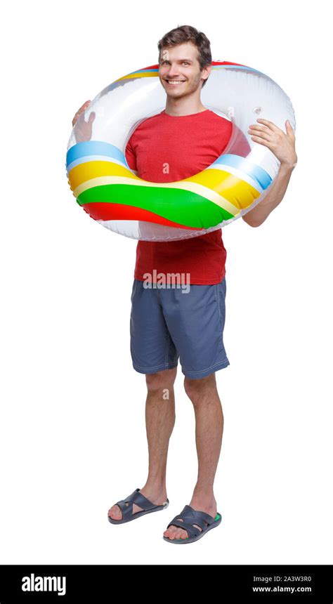 Front View Of A Man In Shorts With An Inflatable Circle Guy On The Beach Rear View People