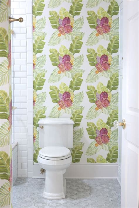 The saloon bar on the ground floor has walls lined with polychrome tiles and a tiled floral frieze. anthropologie wallpaper in marble bathroom #boldprint # ...