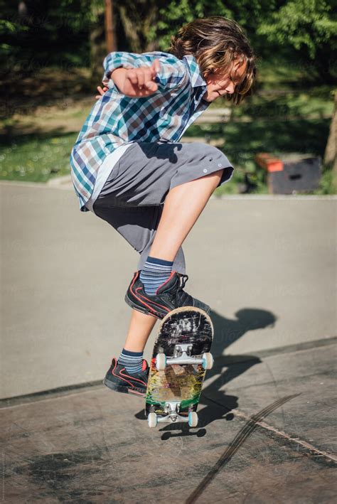Boy Riding A Skateboard By Stocksy Contributor Boris Jovanovic