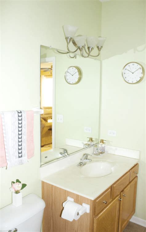 Keep a small bathroom's color palette to a minimum. Small Bathroom Refresh With Modern Decor & Pretty Storage ...