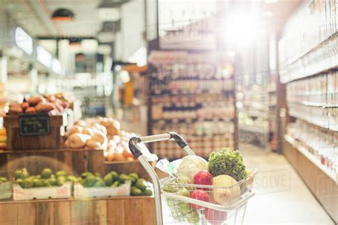 Fresh Produce In Shopping Cart In Grocery Store Market Stock Photo