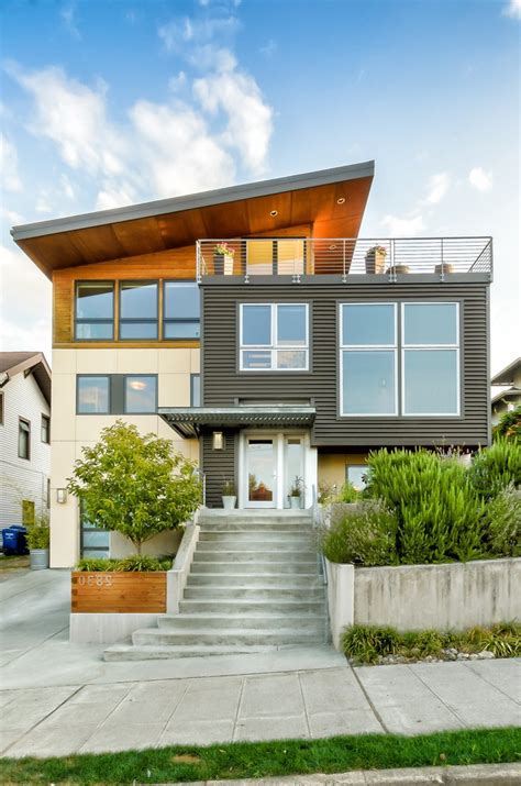 One trend occurring now is focusing on using more than one type of siding and style of cladding on a house. seattle house siding options exterior modern with wood ...
