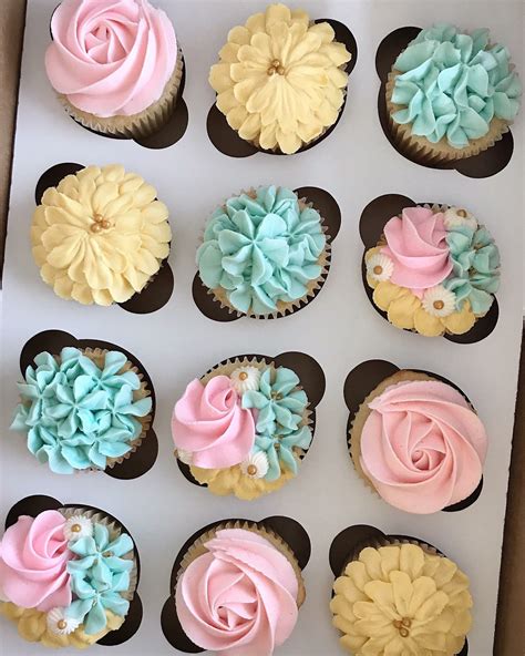 Buttercream baby boy shower cupcakes. Pink, Blue, Teal, and Yellow buttercream flower cupcakes ...