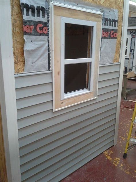 Take the vinyl siding pieces removed earlier and cut them down to fit around the window. 2015 BCT Blog - Brittany