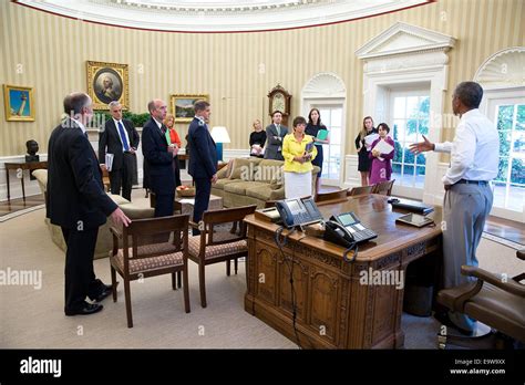 President Barack Obama Meets With Senior Staff In The Oval Office Stock