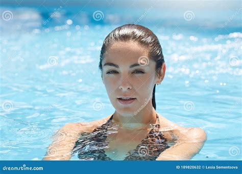 Beautiful Woman With Perfect Body In Stylish Bikini Relaxing In Swimming Pool Has Holidays At