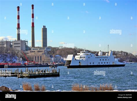 Car and passenger ferry from Bridgeport CT approaches dock at Port ...