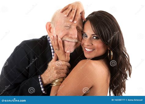 Rich Elderly Man With Gold Digger Wife Stock Image