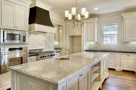 British cabinetry at its best. white cabinets and light countertops. dark hood ...