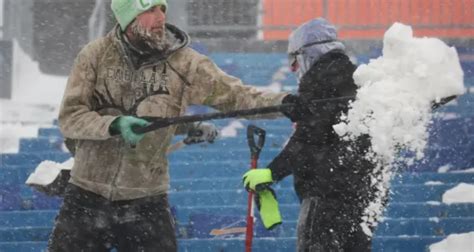 Buffalo Bills Fans Having Fun While Getting Paid To Shovel Snow At