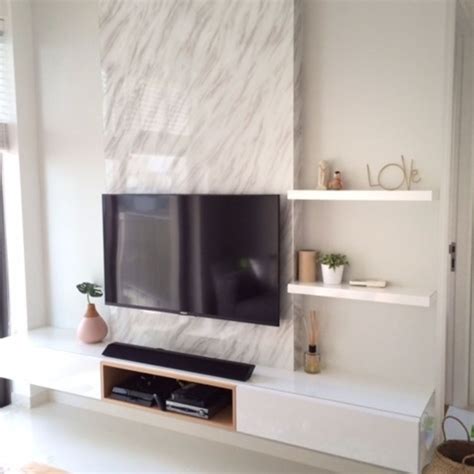Tv Feature Wall With A Single Panel Marble Backdrop And White Finish