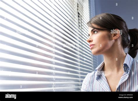 Woman Spying Window Hi Res Stock Photography And Images Alamy