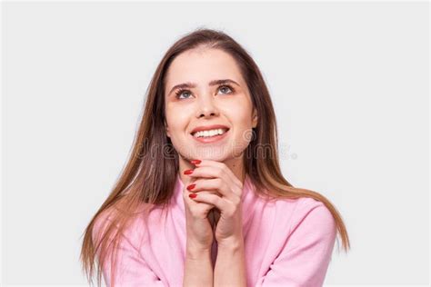 Pretty Young Woman With Positive Smile Holding Hands On The Chin