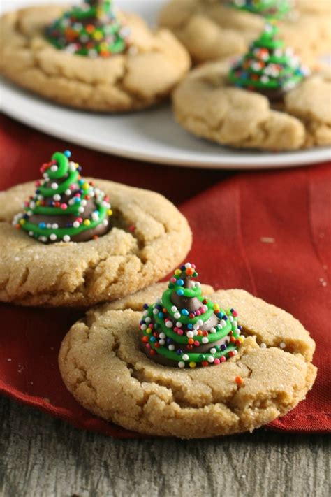 Baking cookies at christmas is a time honored tradition in this family. Christmas Peanut Blossom Cookies - Reindeer, Christmas ...